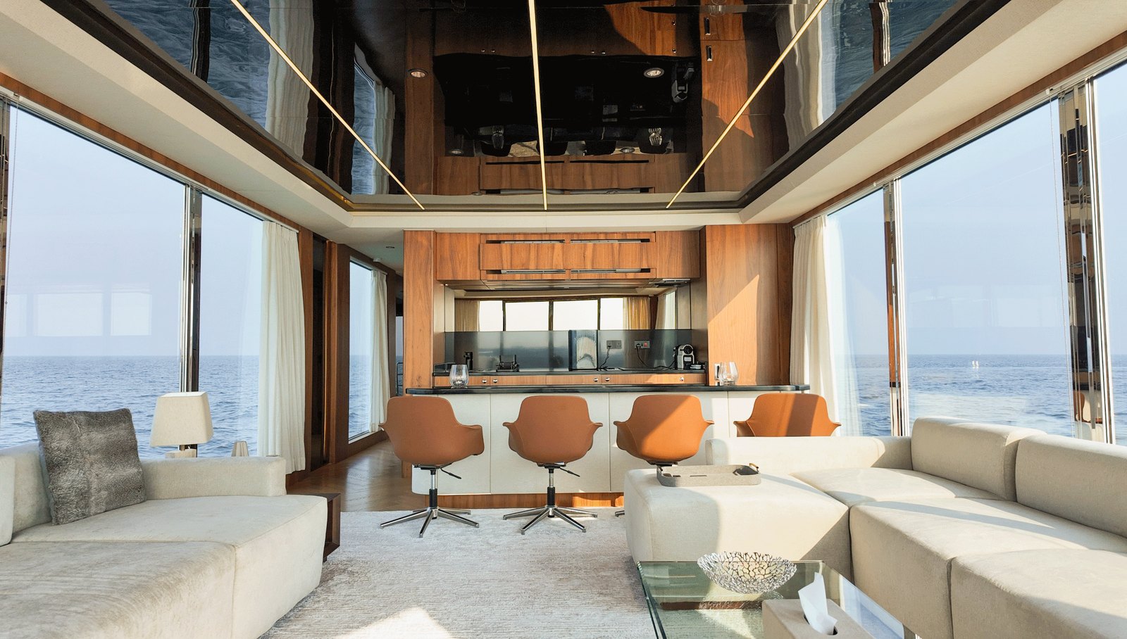 NERO 75 main saloon with sofas, a bar and floor-to-ceiling glazing on both sides